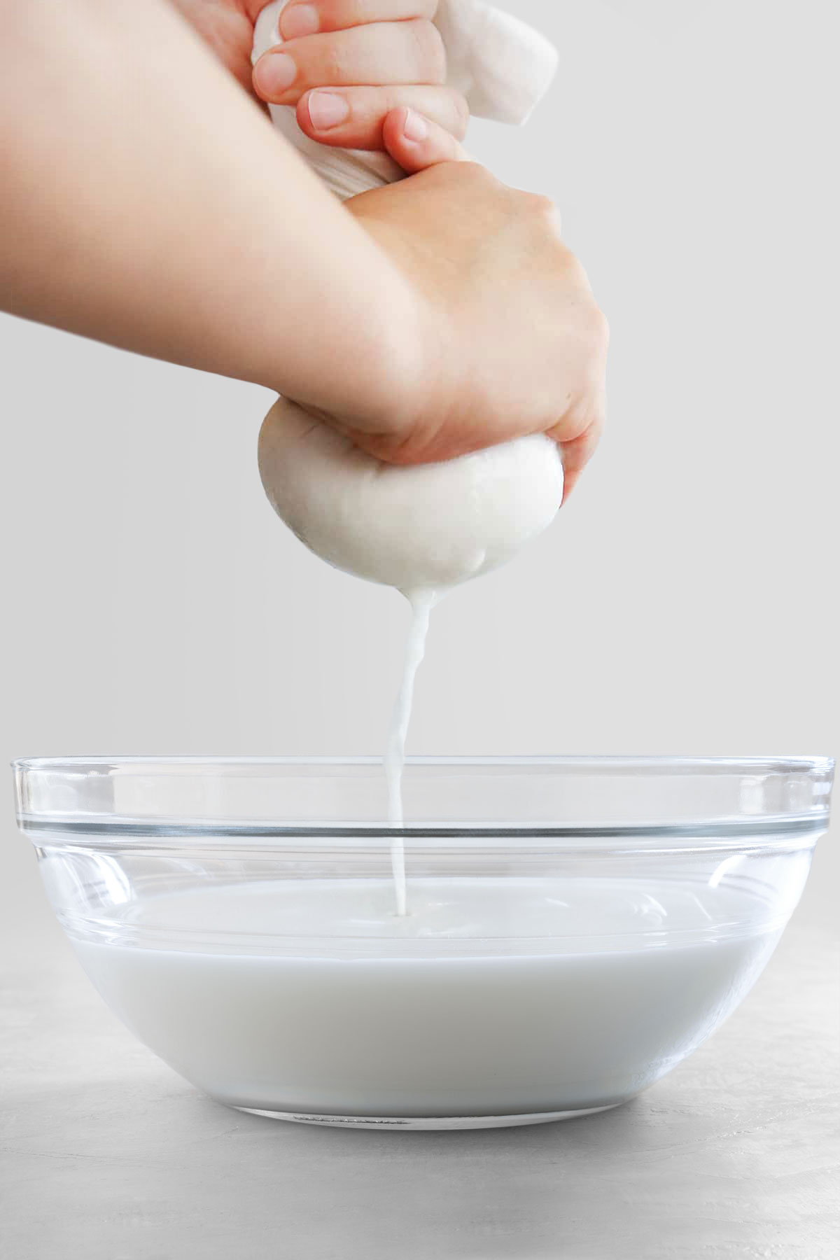 straining coconut milk