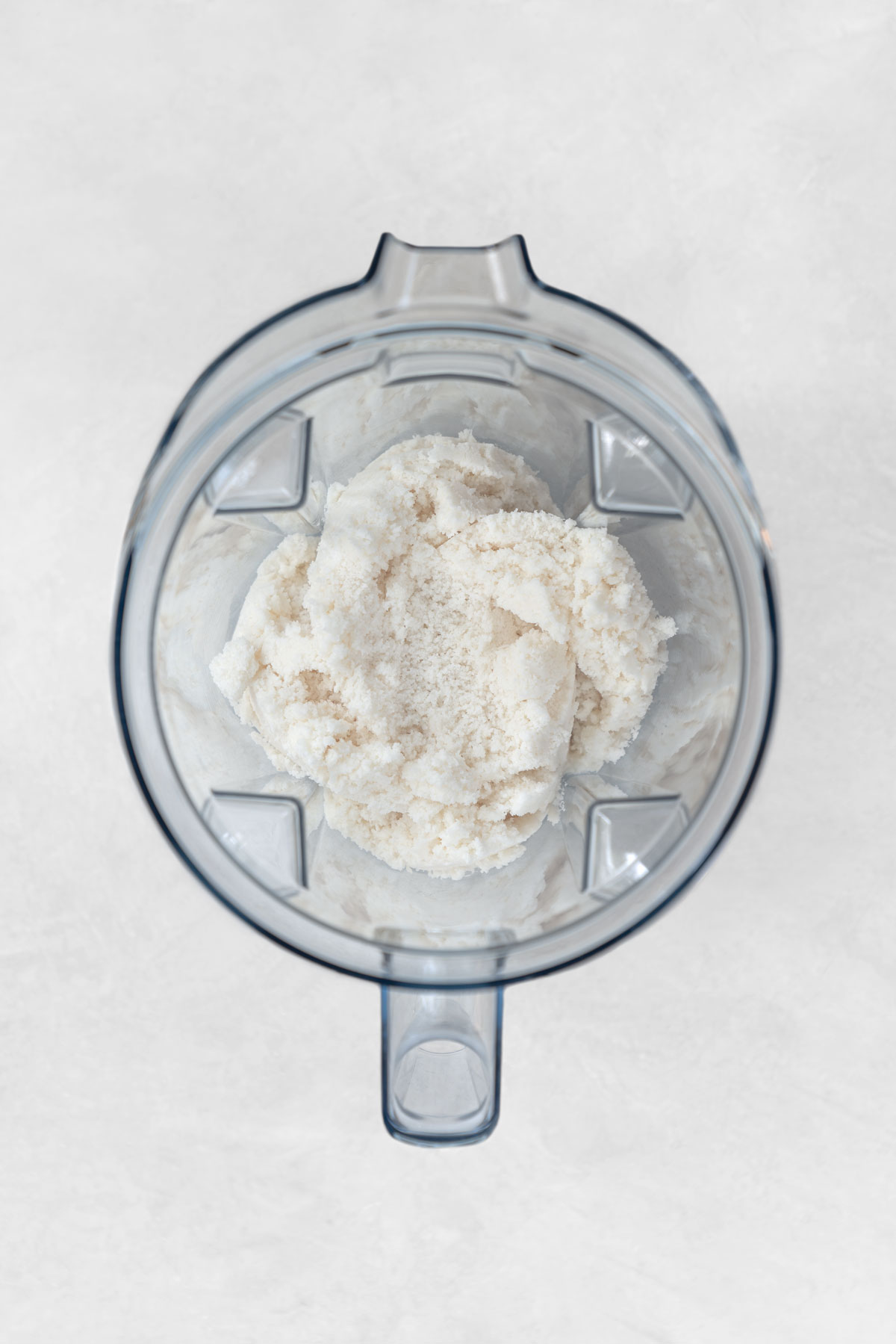 blending coconut butter in a Vitamix blender